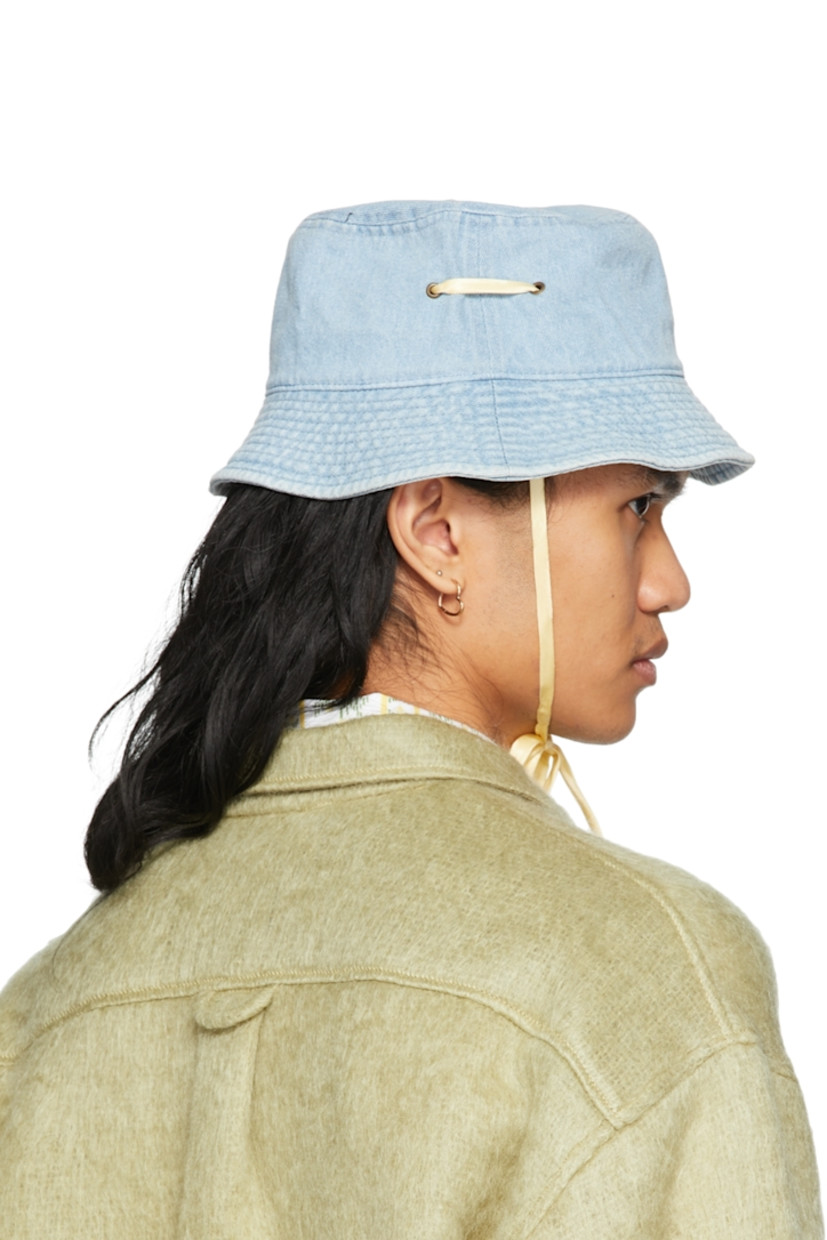 Non-stretch denim bucket hat in blue. 

· Quilted brim 
· Eyelets at crown
· Silk self-tie chin strap 

Supplier color: Vintage wash