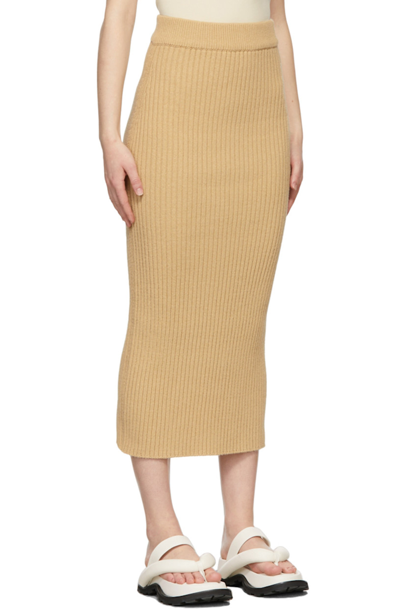 Rib knit cotton-blend skirt in beige. 

· Mid-rise 
· Elasticized waistband
· Central vent at back hem

Supplier color: Beige