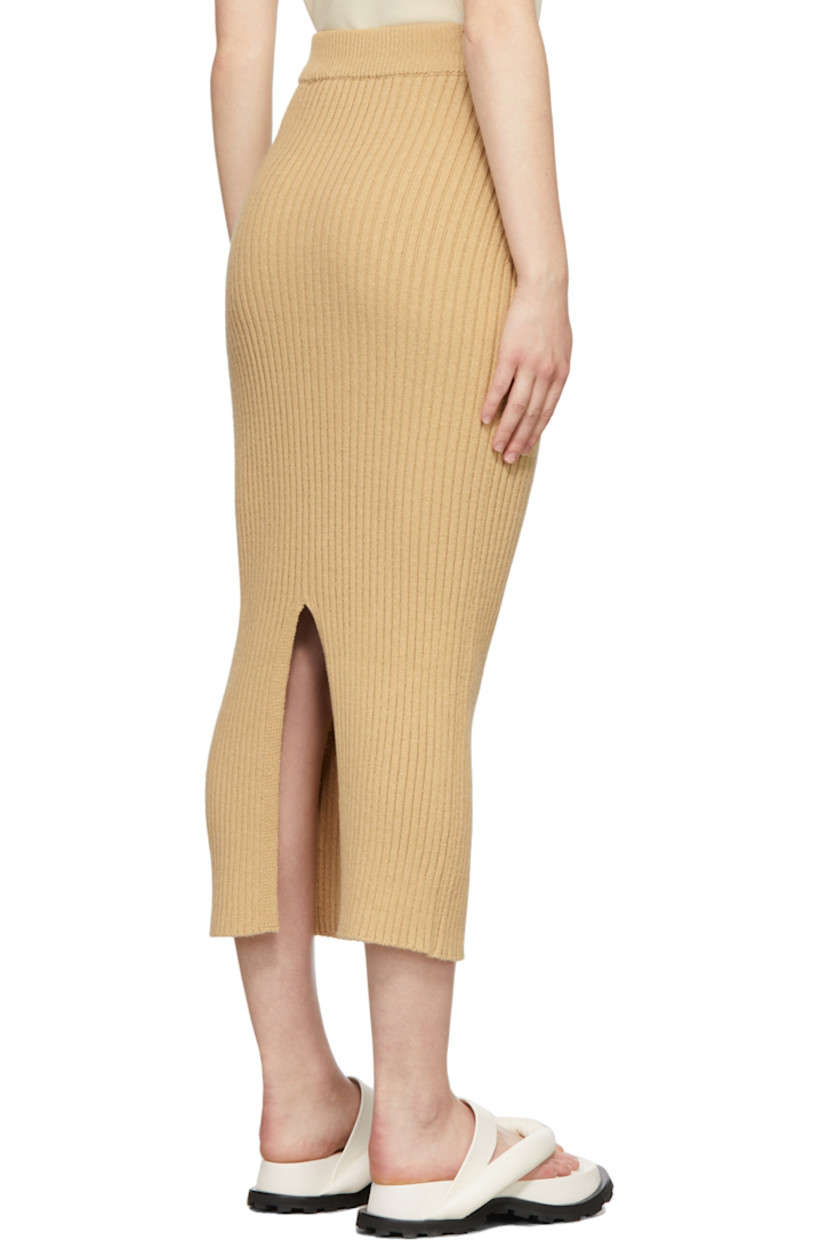 Rib knit cotton-blend skirt in beige. 

· Mid-rise 
· Elasticized waistband
· Central vent at back hem

Supplier color: Beige