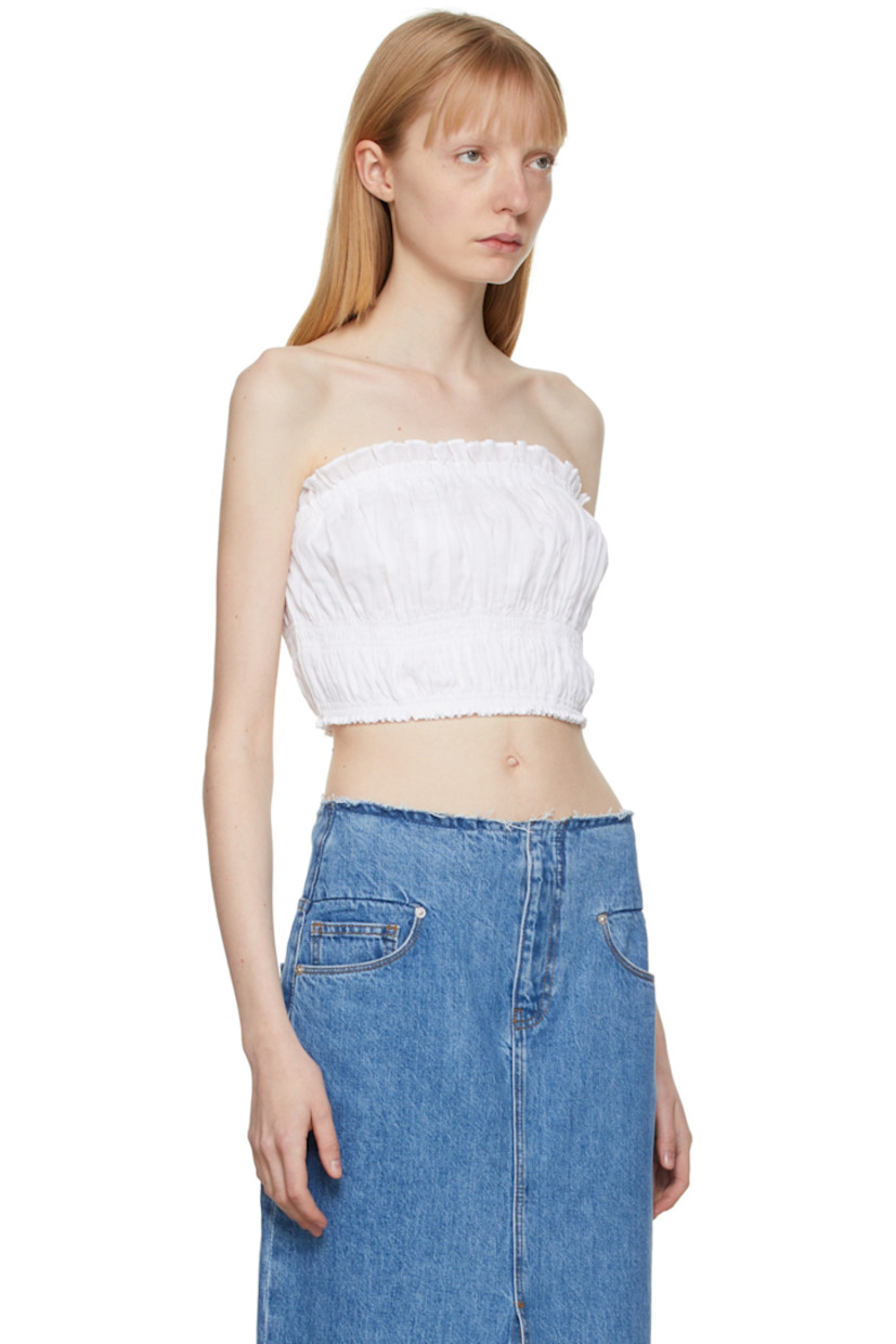 Sleeveless plain-woven ramie tank top in white featuring ruffled detailing at elasticized neckline and hem. Cotton lining.

Supplier color: Blanc