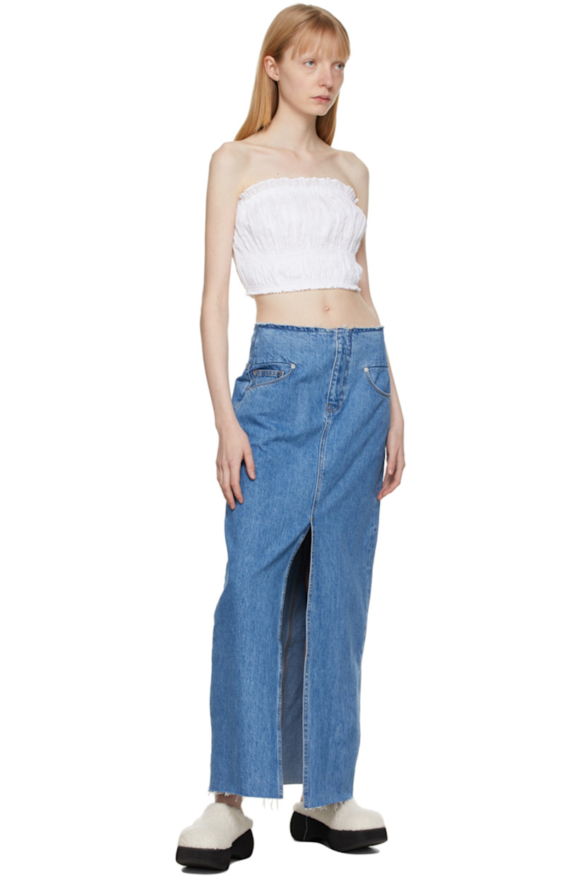 Sleeveless plain-woven ramie tank top in white featuring ruffled detailing at elasticized neckline and hem. Cotton lining.

Supplier color: Blanc