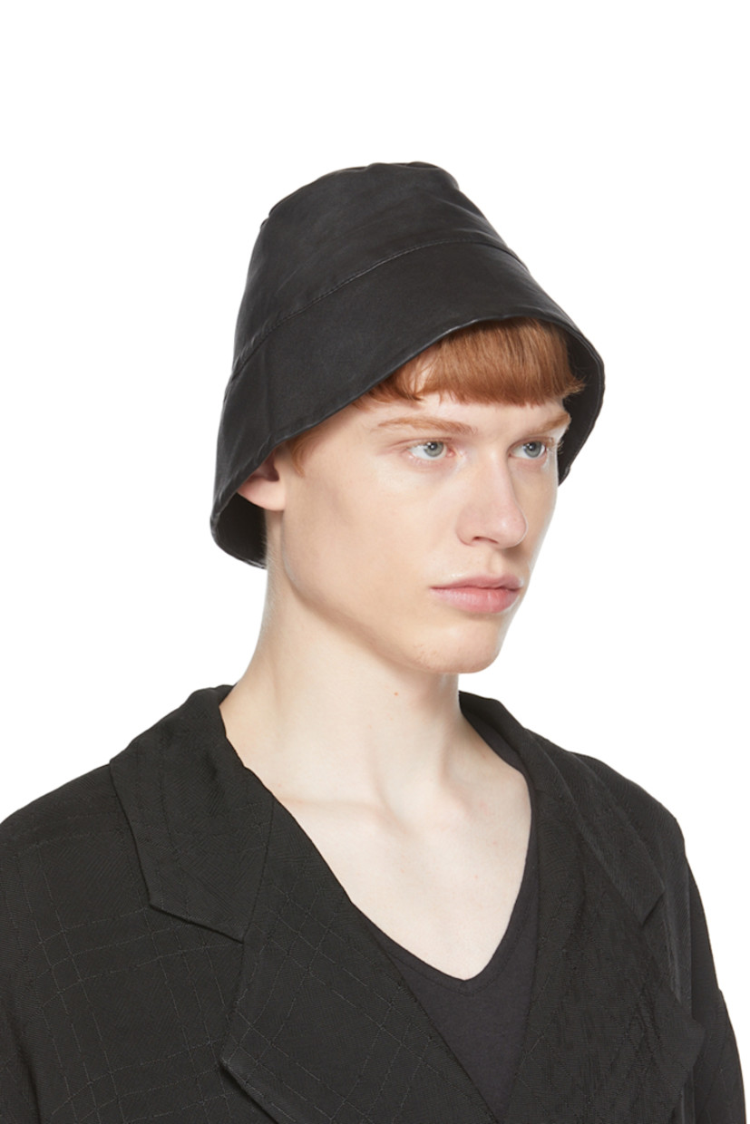 Buffed leather bucket hat in black.

Supplier color: Tar