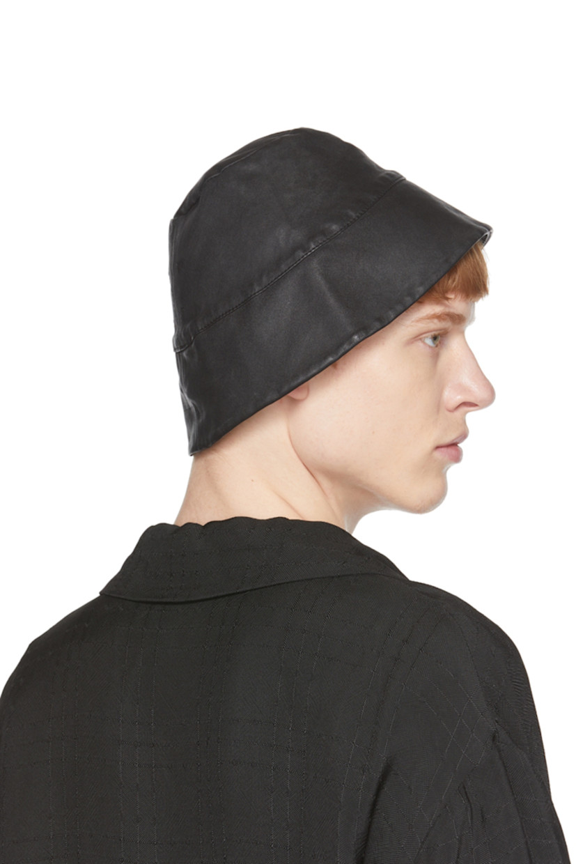 Buffed leather bucket hat in black.

Supplier color: Tar