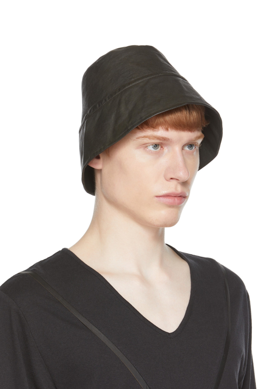 Buffed leather bucket hat in green.

Supplier color: Calone