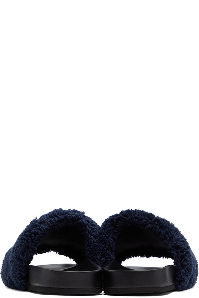 Faux-leather slip-on flat sandals in black. Padded terrycloth strap in navy with textile logo graphic patch at vamp.

· Logo embossed at molded footbed
· Textured rubber sole

Made from cruelty-free, non-animal materials.

Part of the Stella McCartney Disney Fantasia capsule collection.

Supplier color: Navy