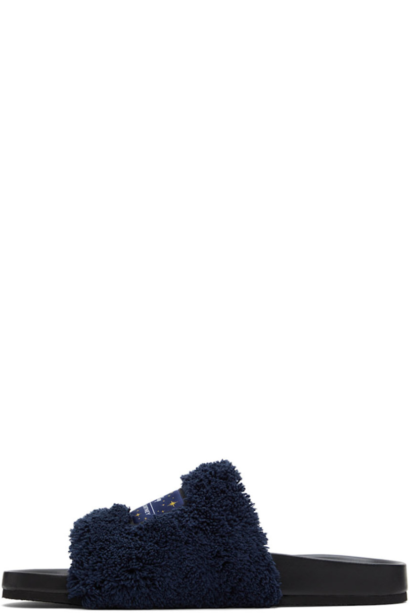 Faux-leather slip-on flat sandals in black. Padded terrycloth strap in navy with textile logo graphic patch at vamp.

· Logo embossed at molded footbed
· Textured rubber sole

Made from cruelty-free, non-animal materials.

Part of the Stella McCartney Disney Fantasia capsule collection.

Supplier color: Navy