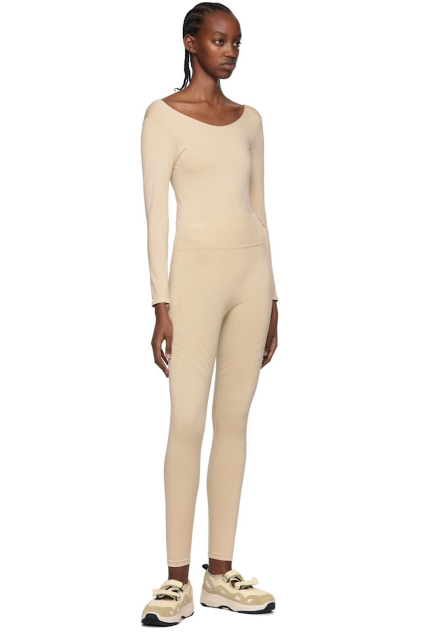 Stretch nylon jersey bodysuit. Moisture-wicking, chlorine-resistant, quick-drying.

· Scoop neck
· Low back

Supplier color: Sand

Size 1 is equivalent to US 2-12
Size 2 is equivalent to US 14-20