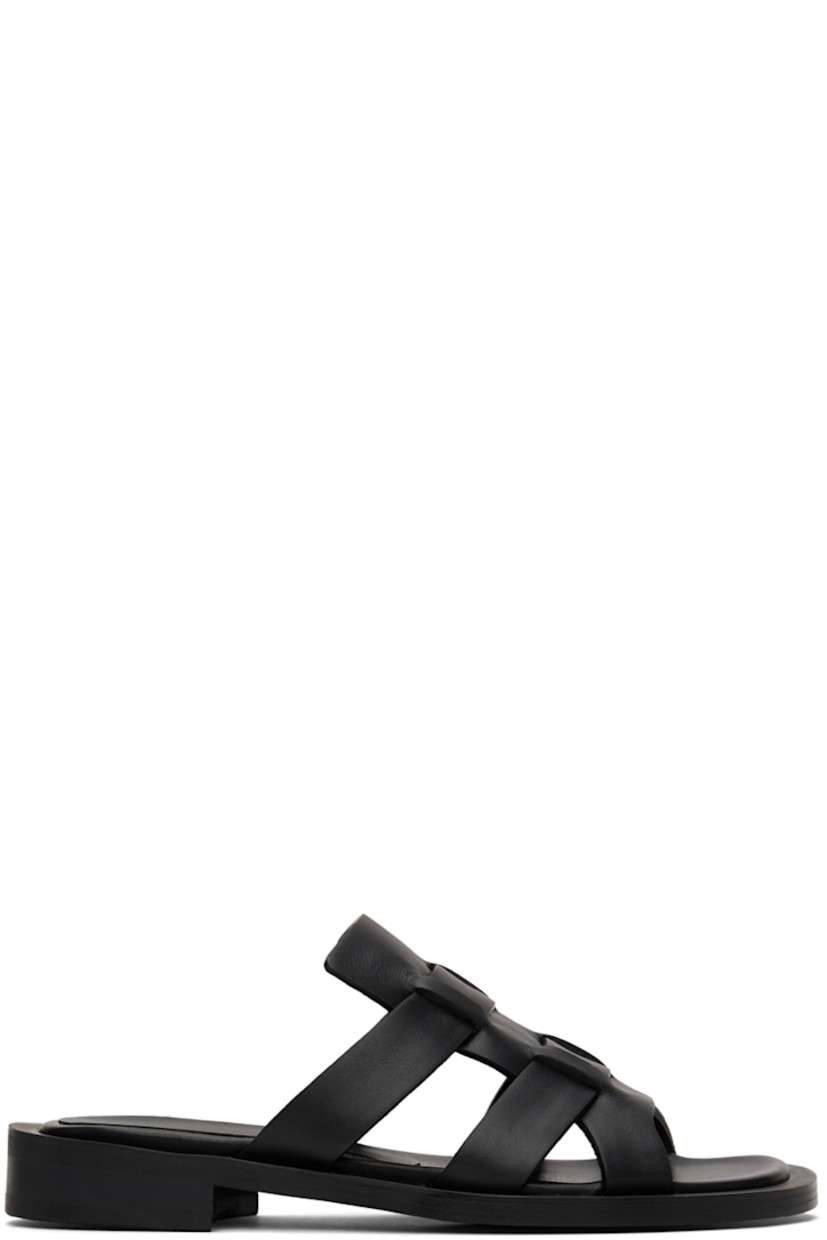 Buffed leather flat sandals in black.

· Open round toe
· Logo embossed at leather footbed
· Stacked leather heel
· Rubber outsole

Supplier color: Black