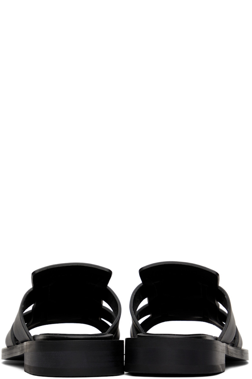 Buffed leather flat sandals in black.

· Open round toe
· Logo embossed at leather footbed
· Stacked leather heel
· Rubber outsole

Supplier color: Black