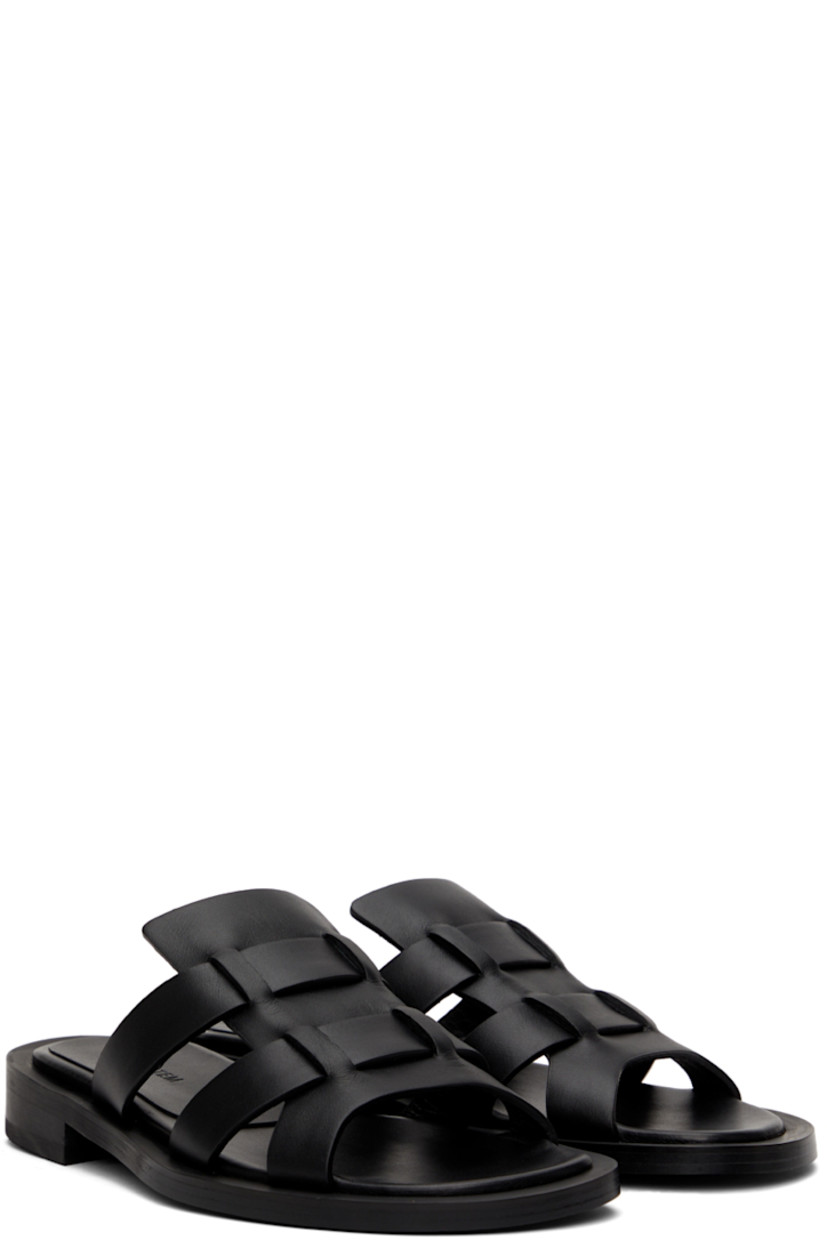 Buffed leather flat sandals in black.

· Open round toe
· Logo embossed at leather footbed
· Stacked leather heel
· Rubber outsole

Supplier color: Black
