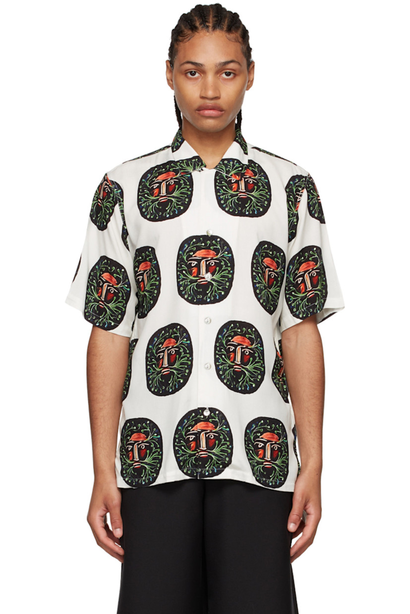 Plain-woven rayon shirt. Graphic pattern printed throughout.

· Open spread collar
· Button closure
· Vented side-seams 
· Mother-of-pearl hardware 

Supplier color: Cream