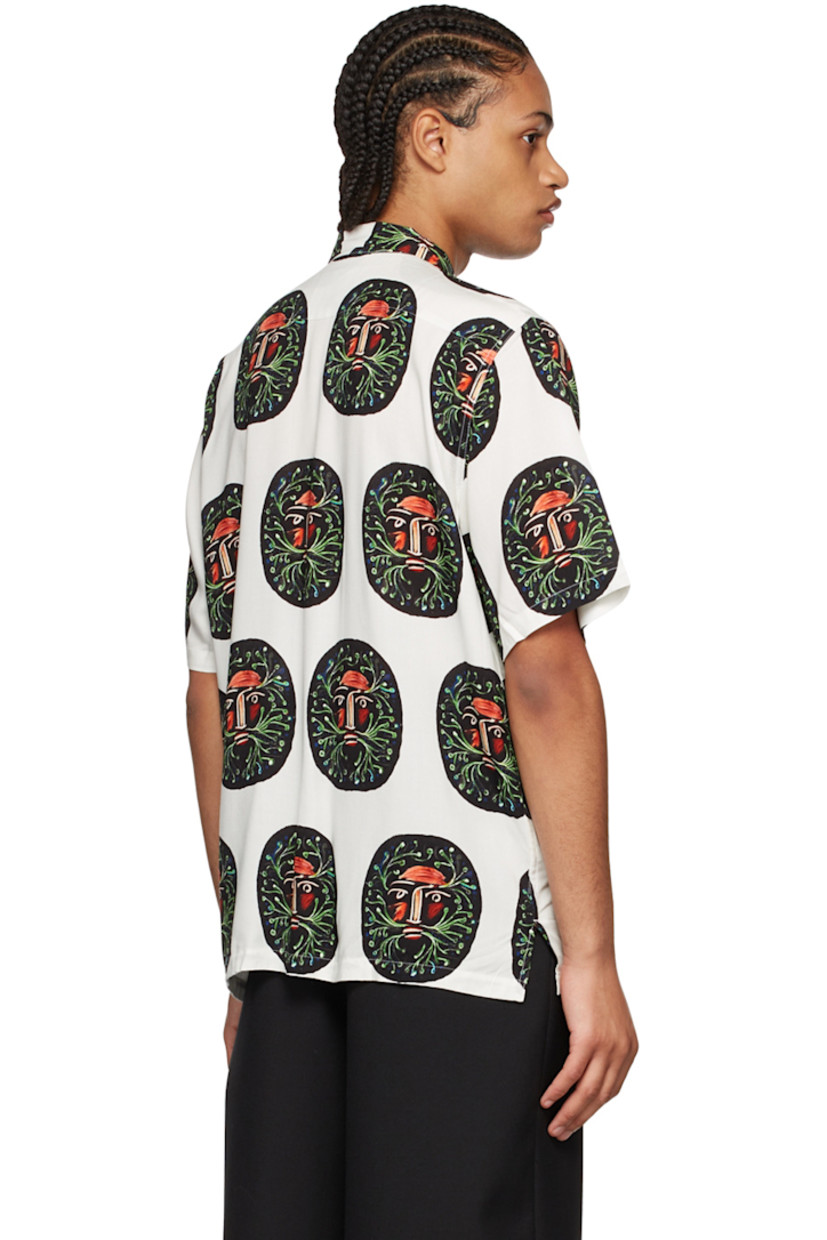 Plain-woven rayon shirt. Graphic pattern printed throughout.

· Open spread collar
· Button closure
· Vented side-seams 
· Mother-of-pearl hardware 

Supplier color: Cream