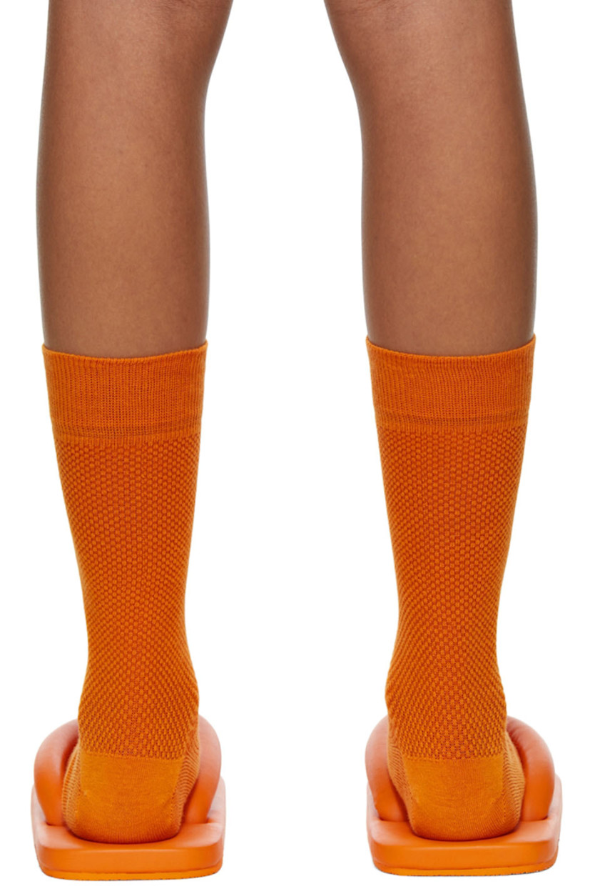 Buffed calfskin slip-on sandals in orange.

· Open square toe
· Padded thong-style strap
· Logo embossed at padded leather footbed
· Treaded rubber sole

Supplier color: Medium orange