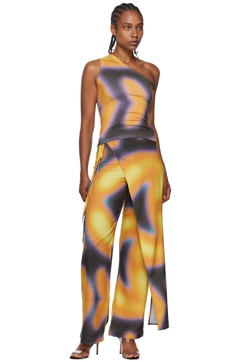 Stretch polyester crepe lounge pants. Graphic pattern printed throughout.

· Wrap construction
· Darts and self-tie fastening waistband
· Zip closure at outseam

Wholesale exclusivity at SSENSE.

Supplier color: Tormenta
