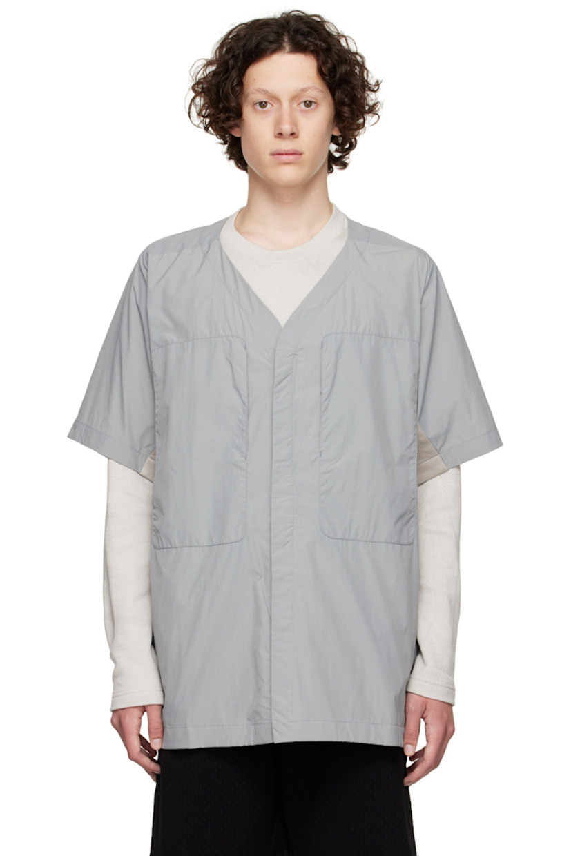 Paneled nylon taffeta and 8-Bit™ knit organic cotton shirt. 

· Y-neck
· Concealed press-stud closure
· Concealed self-tie straps at waist
· Zip pockets
· Seam pockets
· Vent at armscyes
· Patch pockets at interior

Supplier color: Grey multicolour