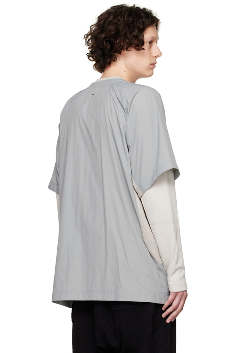 Paneled nylon taffeta and 8-Bit™ knit organic cotton shirt. 

· Y-neck
· Concealed press-stud closure
· Concealed self-tie straps at waist
· Zip pockets
· Seam pockets
· Vent at armscyes
· Patch pockets at interior

Supplier color: Grey multicolour
