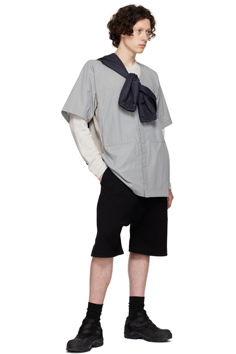 Paneled nylon taffeta and 8-Bit™ knit organic cotton shirt. 

· Y-neck
· Concealed press-stud closure
· Concealed self-tie straps at waist
· Zip pockets
· Seam pockets
· Vent at armscyes
· Patch pockets at interior

Supplier color: Grey multicolour