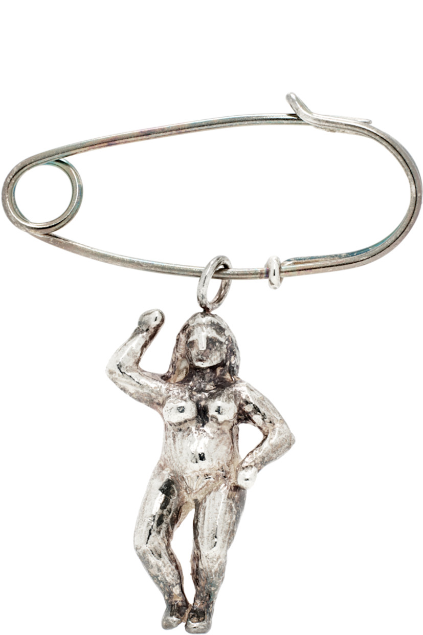 Brooch in antiqued sterling silver.

· Graphic charm at drop
· Safety-pin fastening
· H1.5" x W1.5"

Available exclusively at SSENSE.

Supplier color: Silver