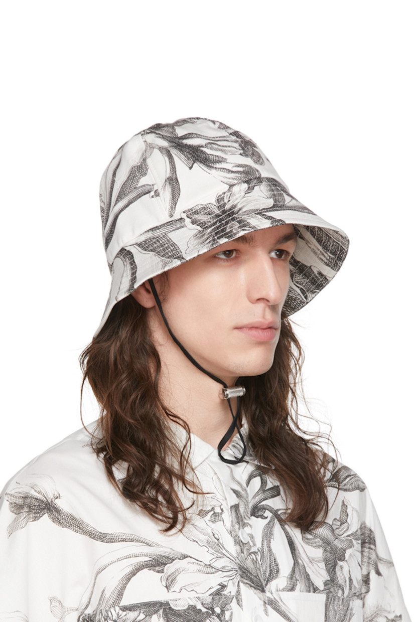 Paneled stretch denim bucket hat featuring graphic pattern printed throughout in black and white.  Adjustable chin strap with logo-engraved cord-lock fastening.

Supplier color: Botancial gabardine