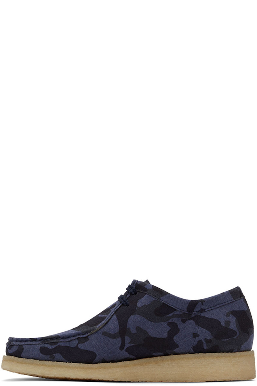 Low-top canvas derbys featuring graphic pattern in tones of blue. 

· Square moc toe 
· Lace-up closure 
· Grained leather lining in tan
· Crêpe rubber outsole 

Supplier color: Blue camo