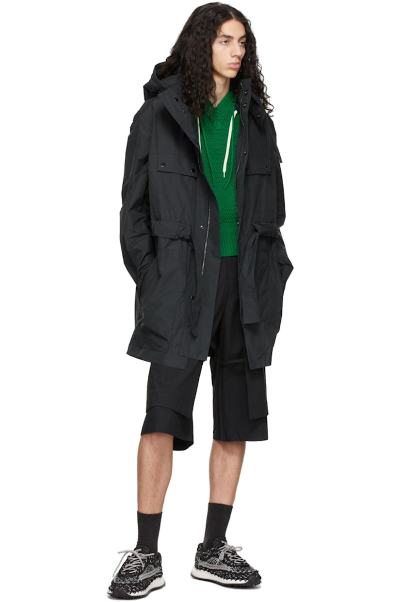 Polyester and nylon-blend sateen coat.

· Drawstring at hood
· Adjustable and detachable elasticized throat guard 
· Concealed two-way zip closure at magnetic press-stud placket 
· Flap pockets and concealed zip pockets
· Detachable self-tie belt 
· Patch pockets at interior
· Unlined

Supplier color: Black