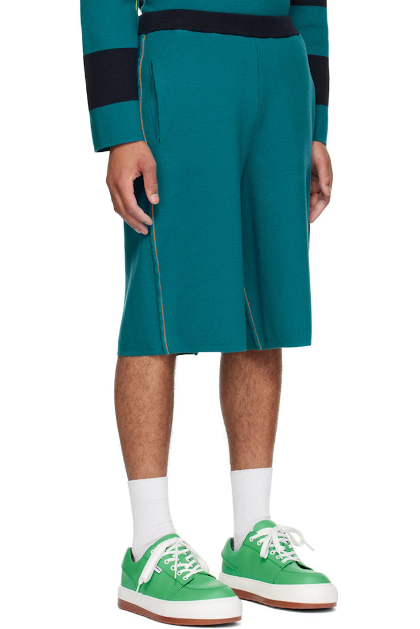 Knit cotton shorts. 

· Elasticized waistband
· Logo flag at outseam
· Four-pocket styling
· Rib knit cuffs
· Pinched seams throughout
· Contrast stitching in orange

Supplier color: Blunero/Ottanio
