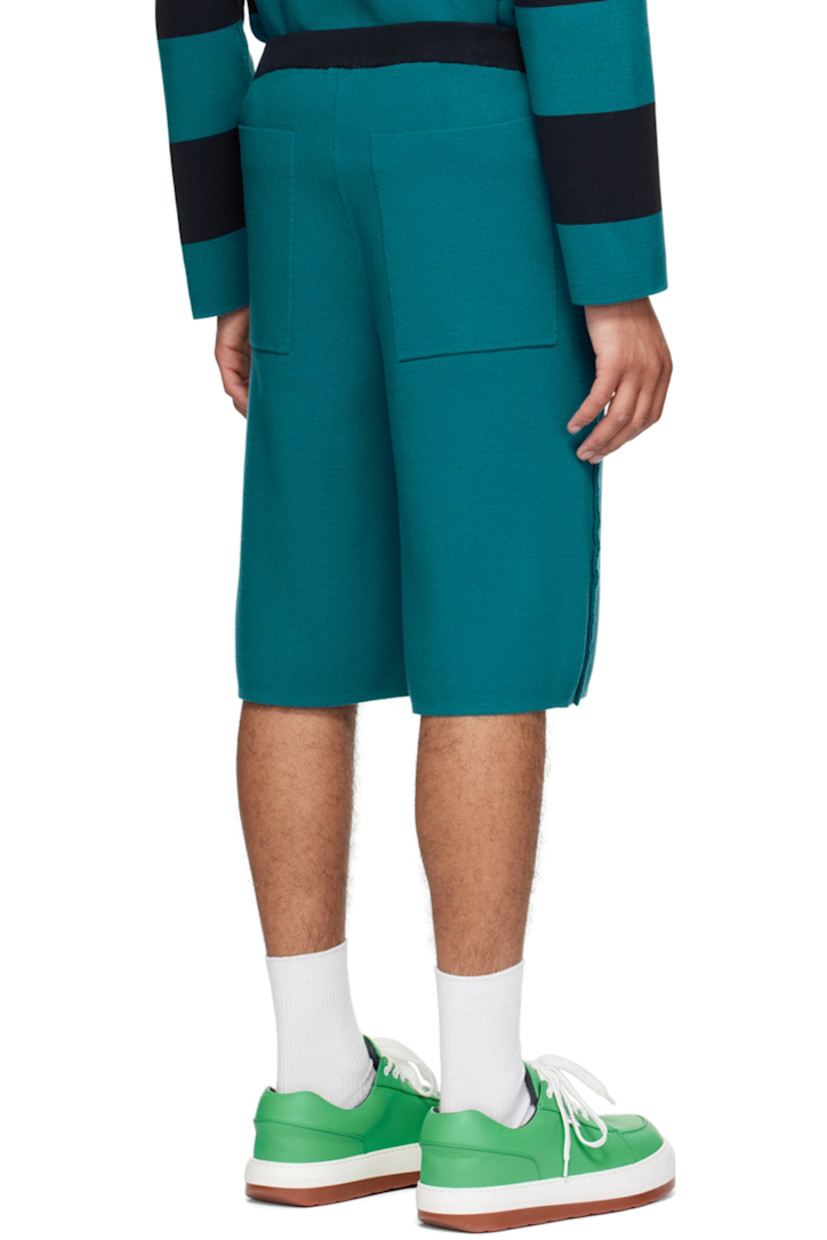 Knit cotton shorts. 

· Elasticized waistband
· Logo flag at outseam
· Four-pocket styling
· Rib knit cuffs
· Pinched seams throughout
· Contrast stitching in orange

Supplier color: Blunero/Ottanio