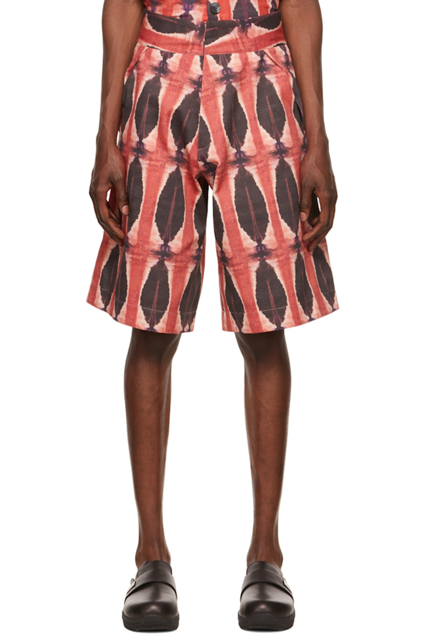 Polyester twill shorts. Tie-dye pattern printed throughout. 

· Belt loops
· Zip-fly
· Four-pocket styling 

Supplier color: Red