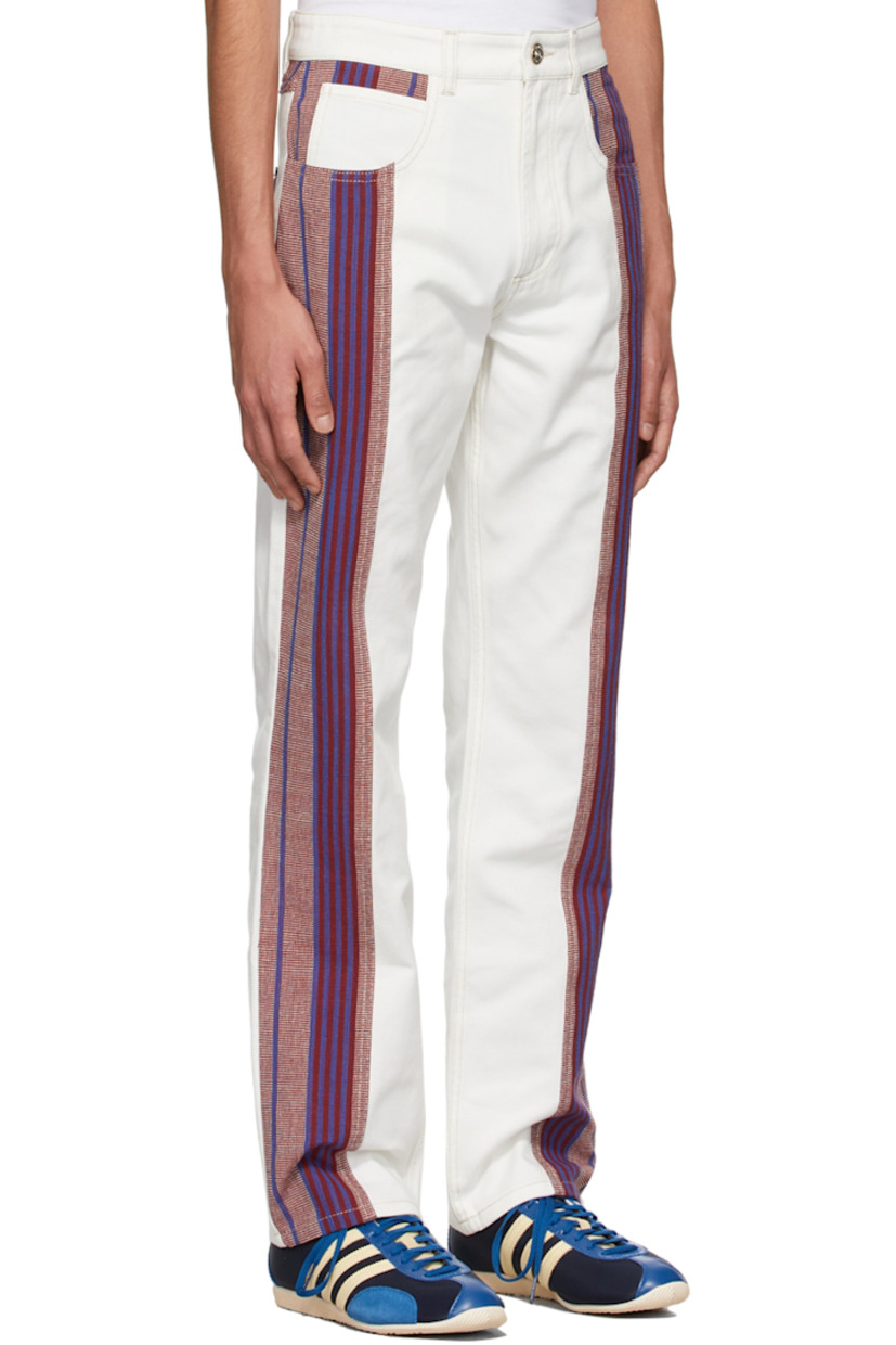 Non-stretch denim jeans. 

· Belt loops  
· Zip-fly 
· Five-pocket styling 
· Hand-woven organic cotton panels throughout
· Logo-engraved hardware

Supplier color: White