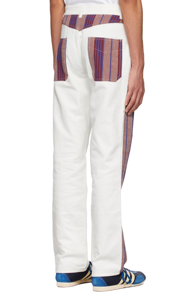 Non-stretch denim jeans. 

· Belt loops  
· Zip-fly 
· Five-pocket styling 
· Hand-woven organic cotton panels throughout
· Logo-engraved hardware

Supplier color: White