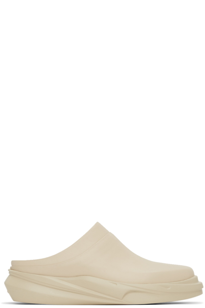 Buffed leather slip-on loafers in beige. 

· Square toe
· Logo embossed at heel counter and footbed
· Sculpted foam rubber midsole
· Treaded rubber outsole

Supplier color: Sand