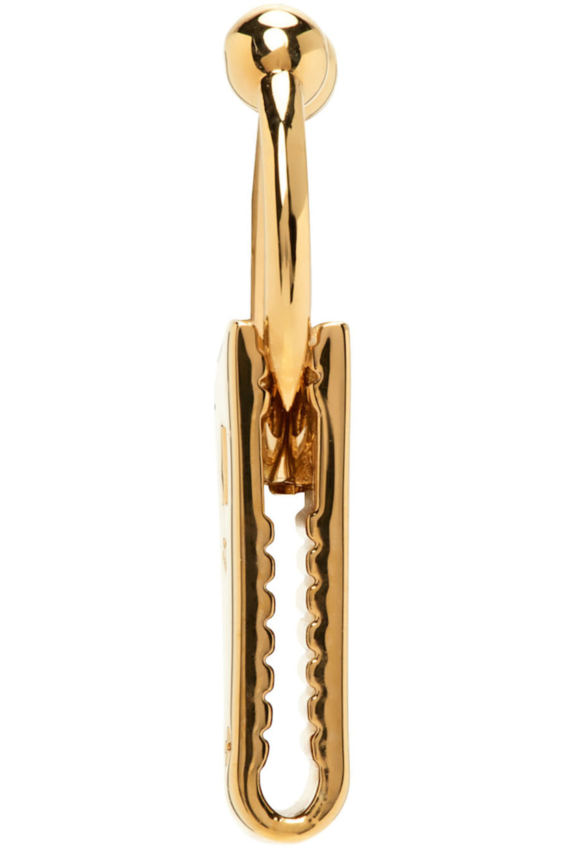 Septum ring in gold-tone brass.

· Logo-engraved hardware at drop
· H1 x W0.5 in

Supplier color: Gold shiny