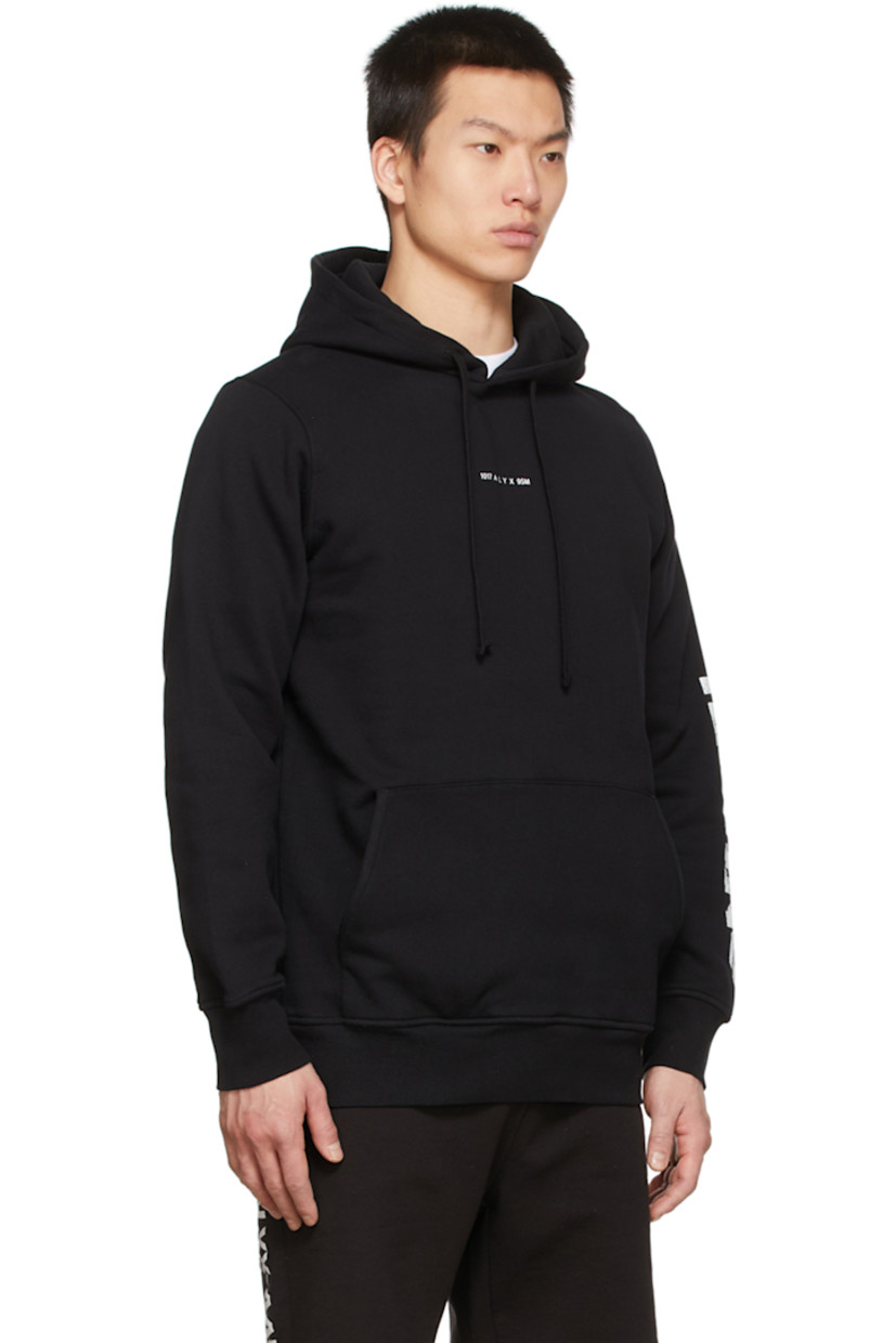 Long sleeve cotton-blend fleece hoodie in black featuring logo printed in white at chest and graphic printed in white at sleeve. Kangaroo pocket.

Supplier color: Black