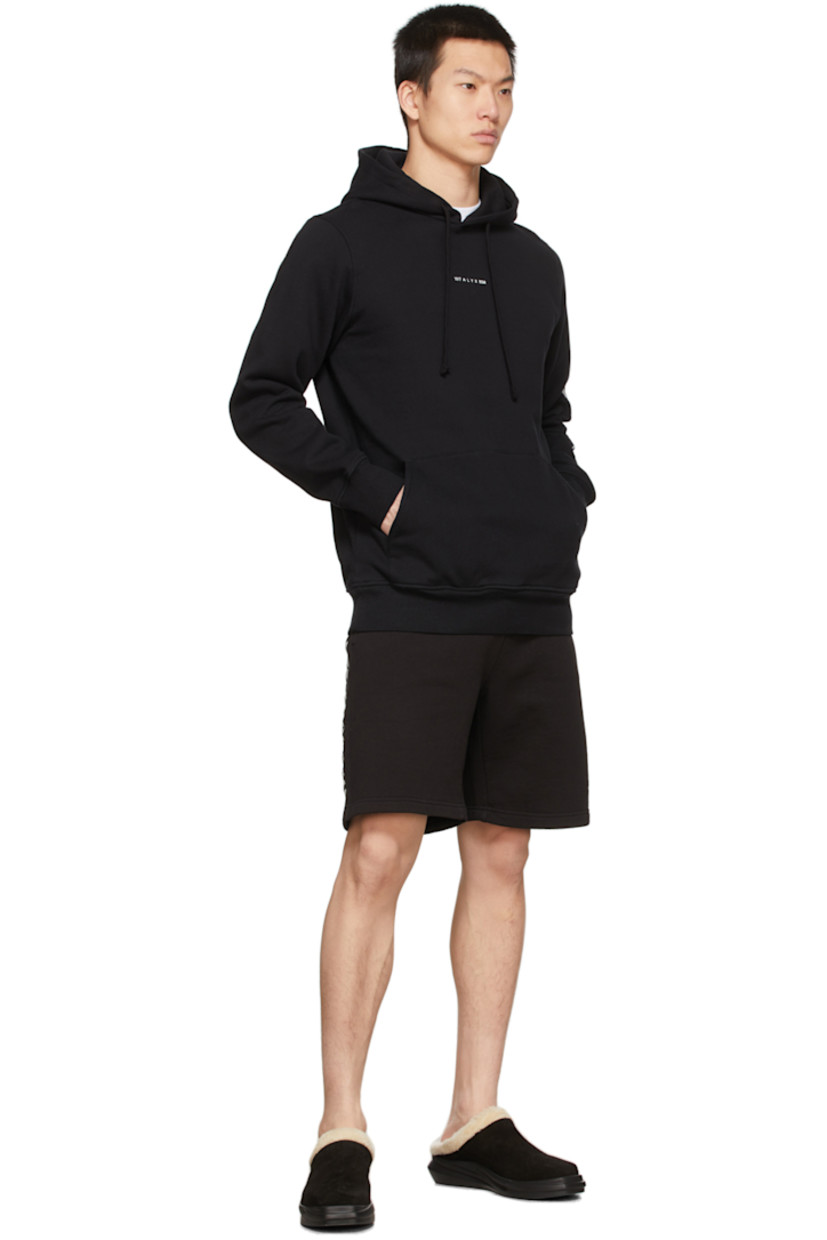 Long sleeve cotton-blend fleece hoodie in black featuring logo printed in white at chest and graphic printed in white at sleeve. Kangaroo pocket.

Supplier color: Black