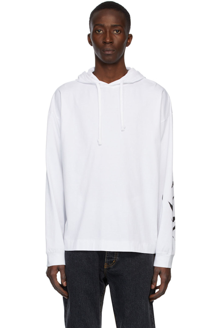 Long sleeve cotton jersey hoodie in white featuring logo graphic printed at sleeve in black.

Supplier color: White
