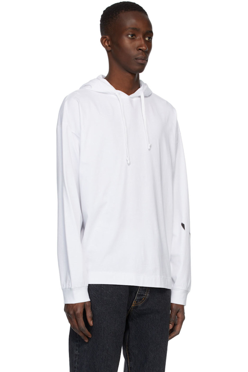 Long sleeve cotton jersey hoodie in white featuring logo graphic printed at sleeve in black.

Supplier color: White