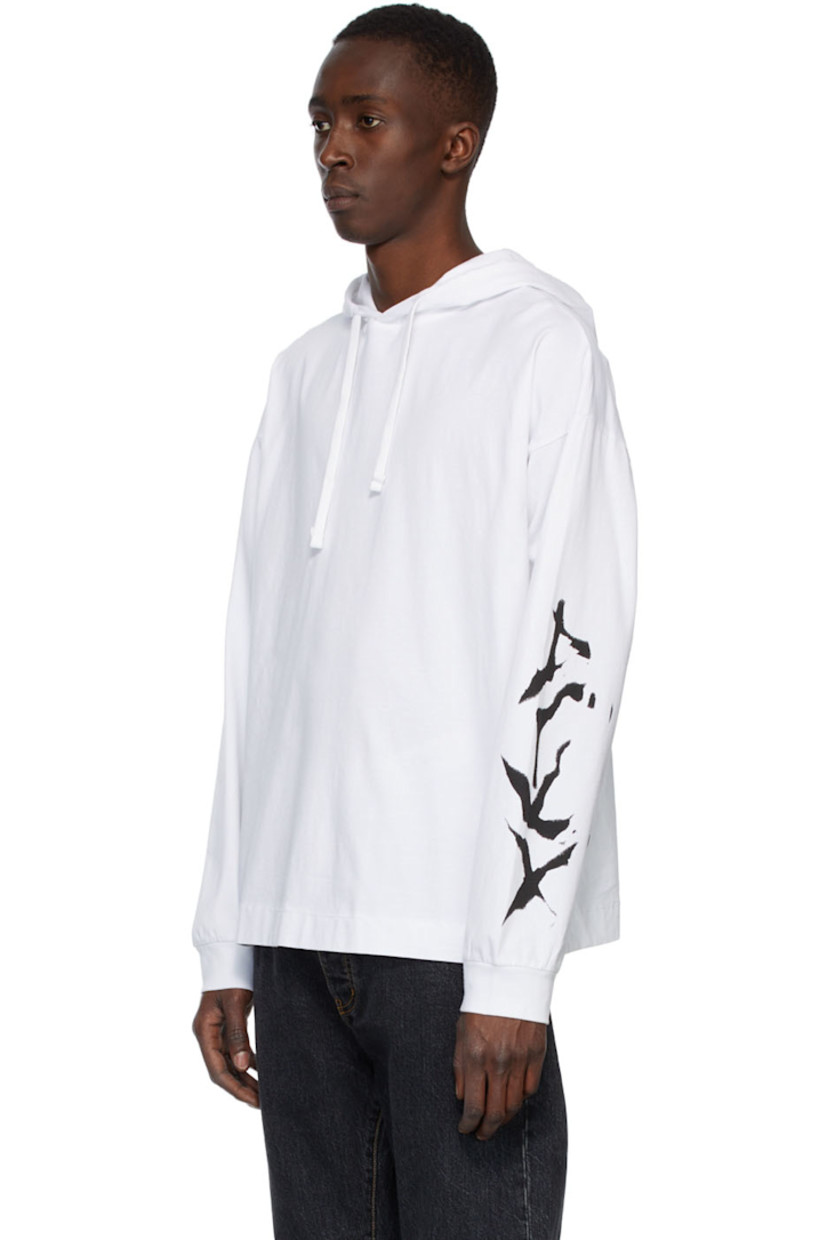 Long sleeve cotton jersey hoodie in white featuring logo graphic printed at sleeve in black.

Supplier color: White