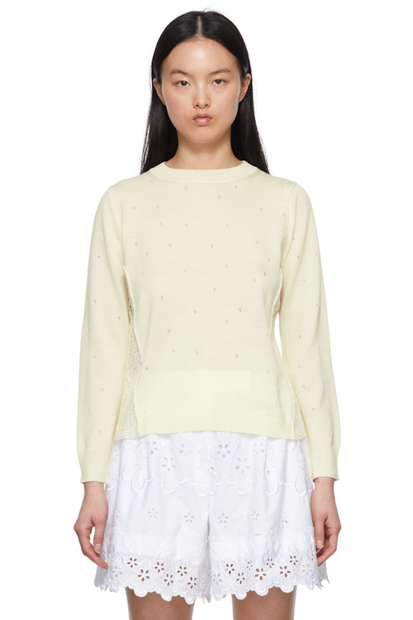 Wool-blend pointelle sweater. 

· Lace trim at side-seams 
· Rib knit crewneck, cuffs, and hem

Supplier color: Off-white