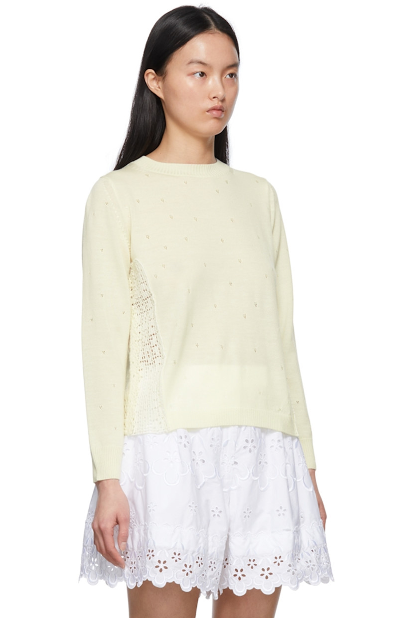 Wool-blend pointelle sweater. 

· Lace trim at side-seams 
· Rib knit crewneck, cuffs, and hem

Supplier color: Off-white