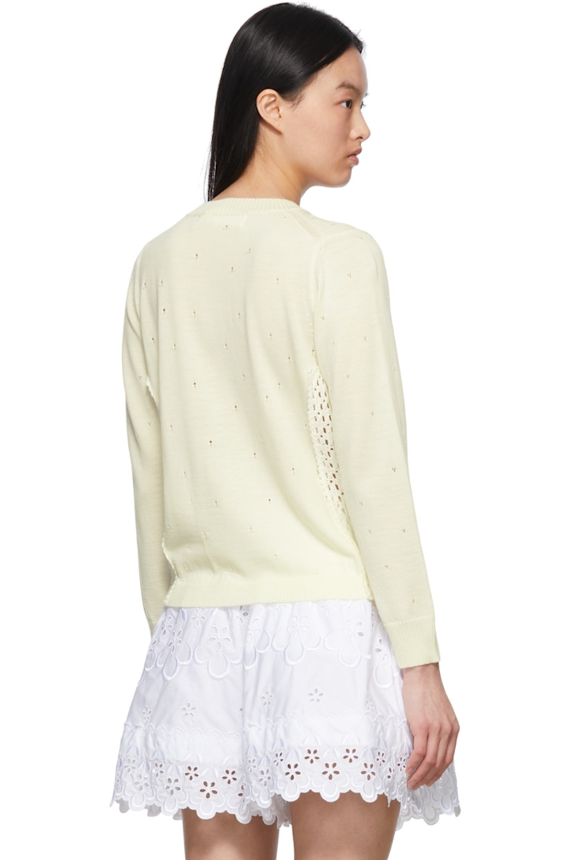 Wool-blend pointelle sweater. 

· Lace trim at side-seams 
· Rib knit crewneck, cuffs, and hem

Supplier color: Off-white