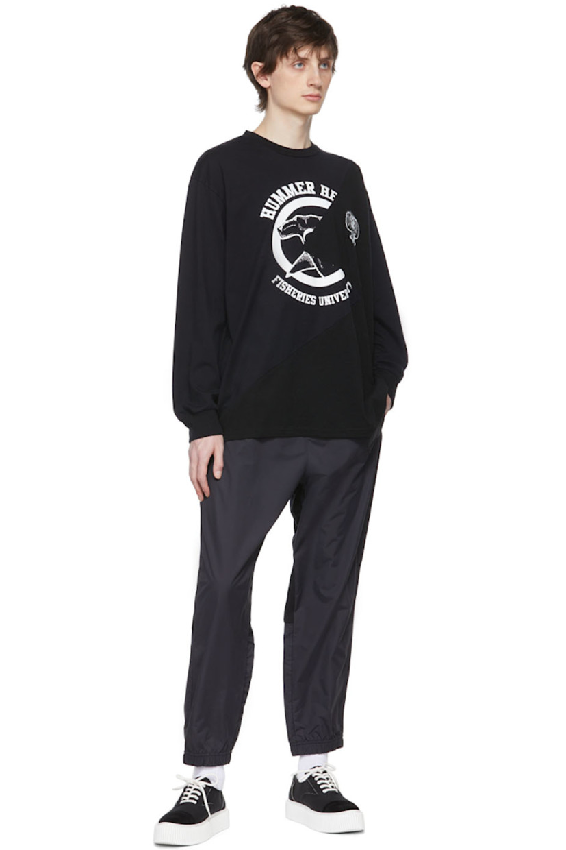 Paneled nylon canvas and French terry lounge pants.

· Concealed drawstring at elasticized waistband
· Textile logo patch at front
· Logo graphic printed at back
· Three-pocket styling

Supplier color: Black