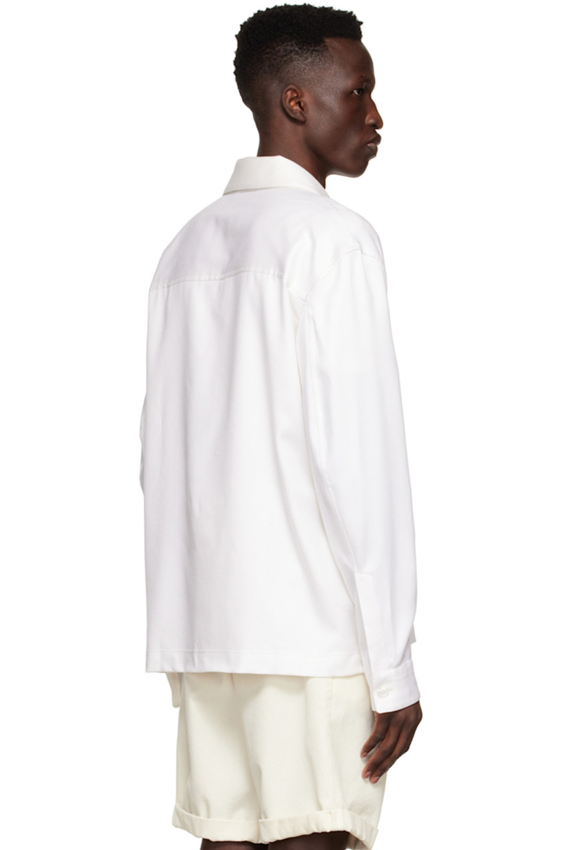Cotton and silk-blend twill shirt. Trim throughout.

· Lapel collar
· Button closure
· Patch pocket at chest
· Welt pockets at waist
· Single-button barrel cuffs
· Vent at hem side-seams
· Partially lined

Supplier color: White