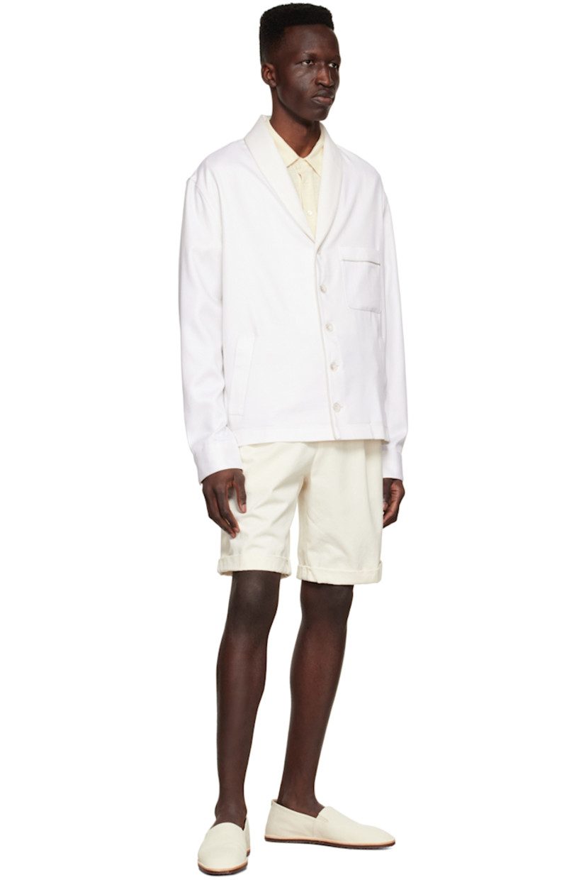 Cotton and silk-blend twill shirt. Trim throughout.

· Lapel collar
· Button closure
· Patch pocket at chest
· Welt pockets at waist
· Single-button barrel cuffs
· Vent at hem side-seams
· Partially lined

Supplier color: White