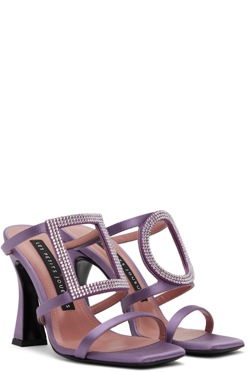 Satin slip-on heeled sandals in purple.

· Open square toe
· Crystal-cut accents at vamp
· Logo patch at grained leather footbed
· Covered stiletto heel with rubber injection
· Buffed leather sole
· Heel: H4 in

Supplier color: Amethyst