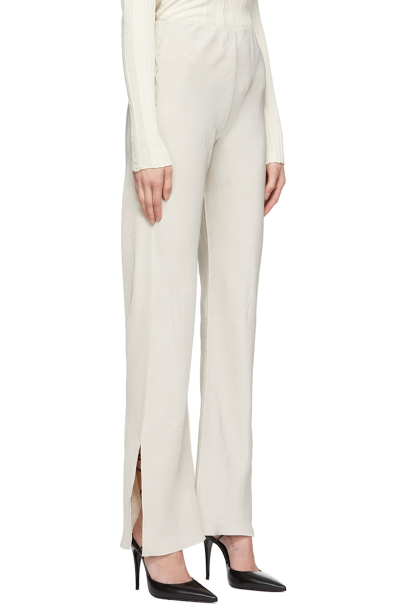 Crinkled acetate satin trousers.

· Elasticized waistband
· Vents at hem
· Exposed seams throughout

Supplier color: Oat