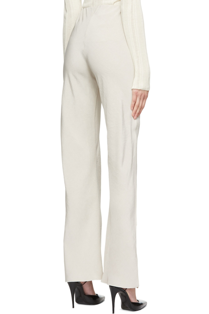 Crinkled acetate satin trousers.

· Elasticized waistband
· Vents at hem
· Exposed seams throughout

Supplier color: Oat