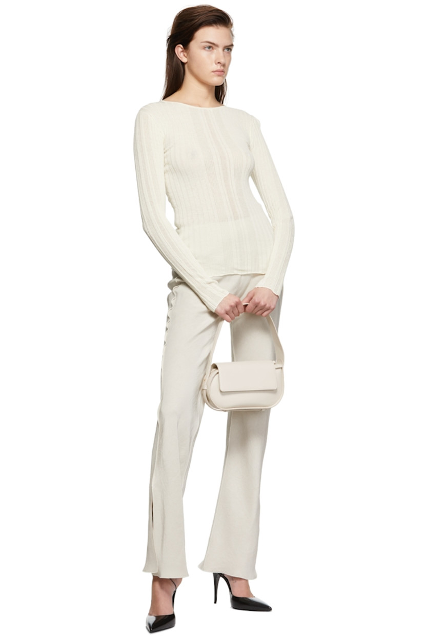 Crinkled acetate satin trousers.

· Elasticized waistband
· Vents at hem
· Exposed seams throughout

Supplier color: Oat