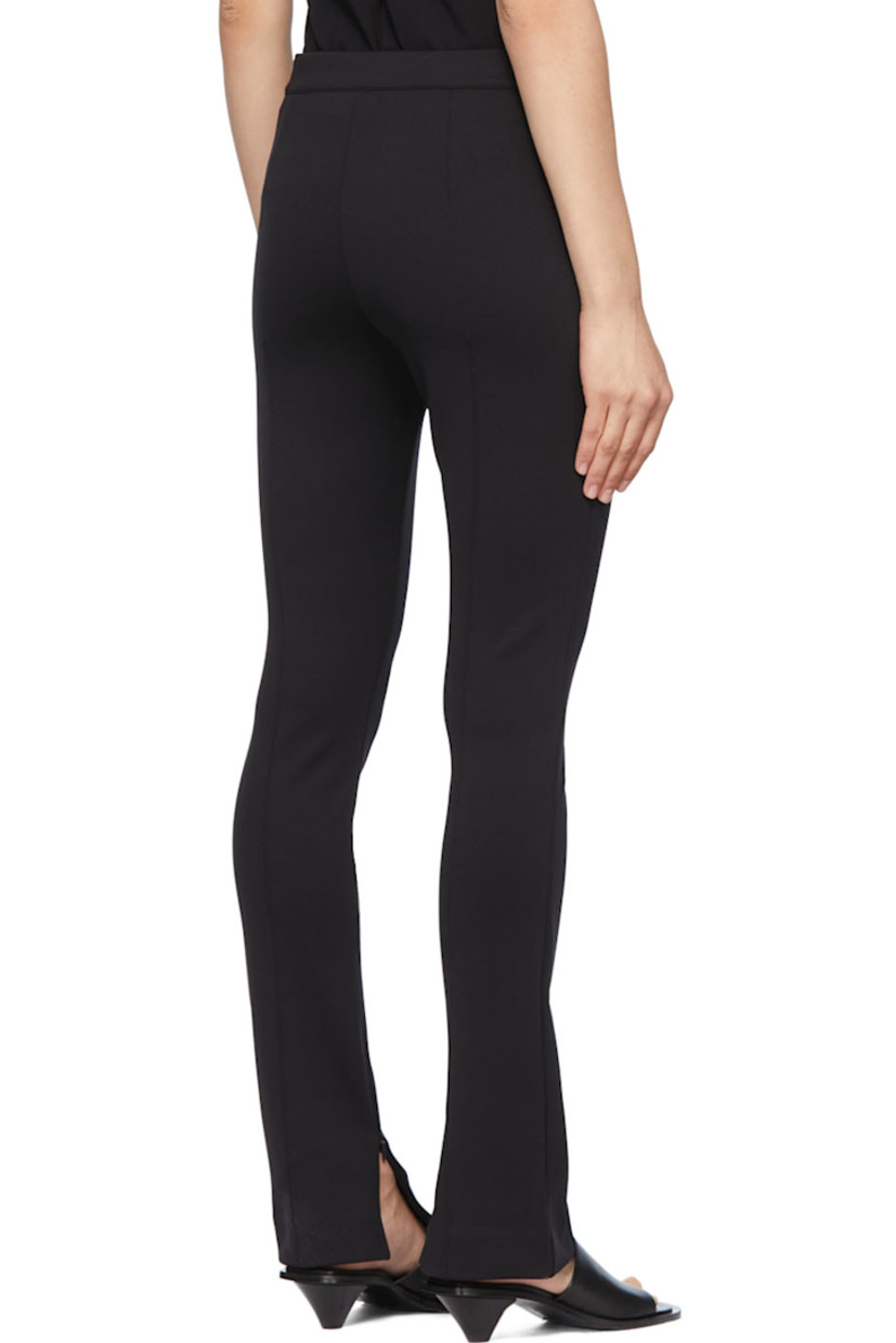 Stretch recycled nylon jersey trousers.

· Zip-fly
· Zippered vent at inseams
· Pinched seams at front and back

Supplier color: Black
