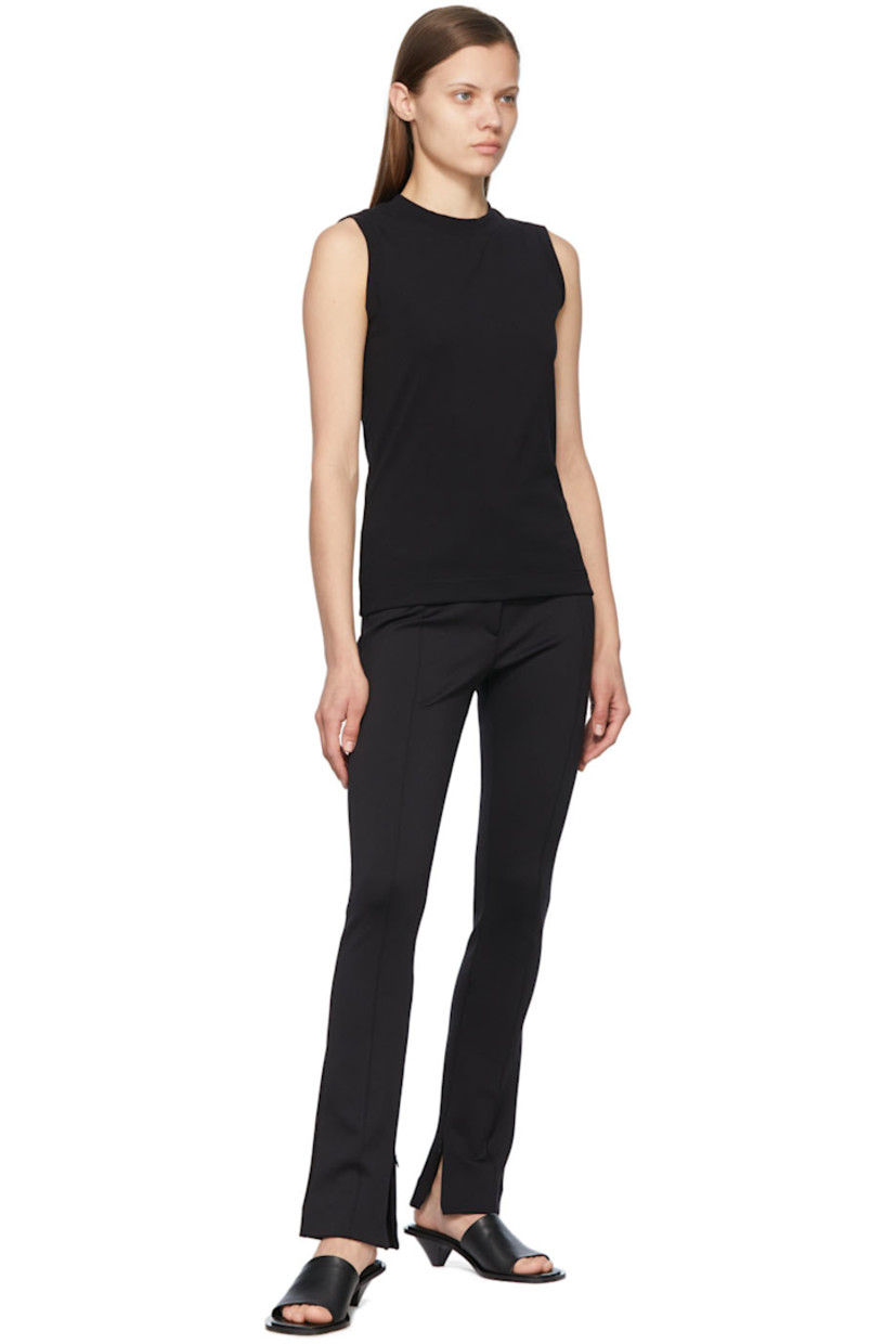 Stretch recycled nylon jersey trousers.

· Zip-fly
· Zippered vent at inseams
· Pinched seams at front and back

Supplier color: Black