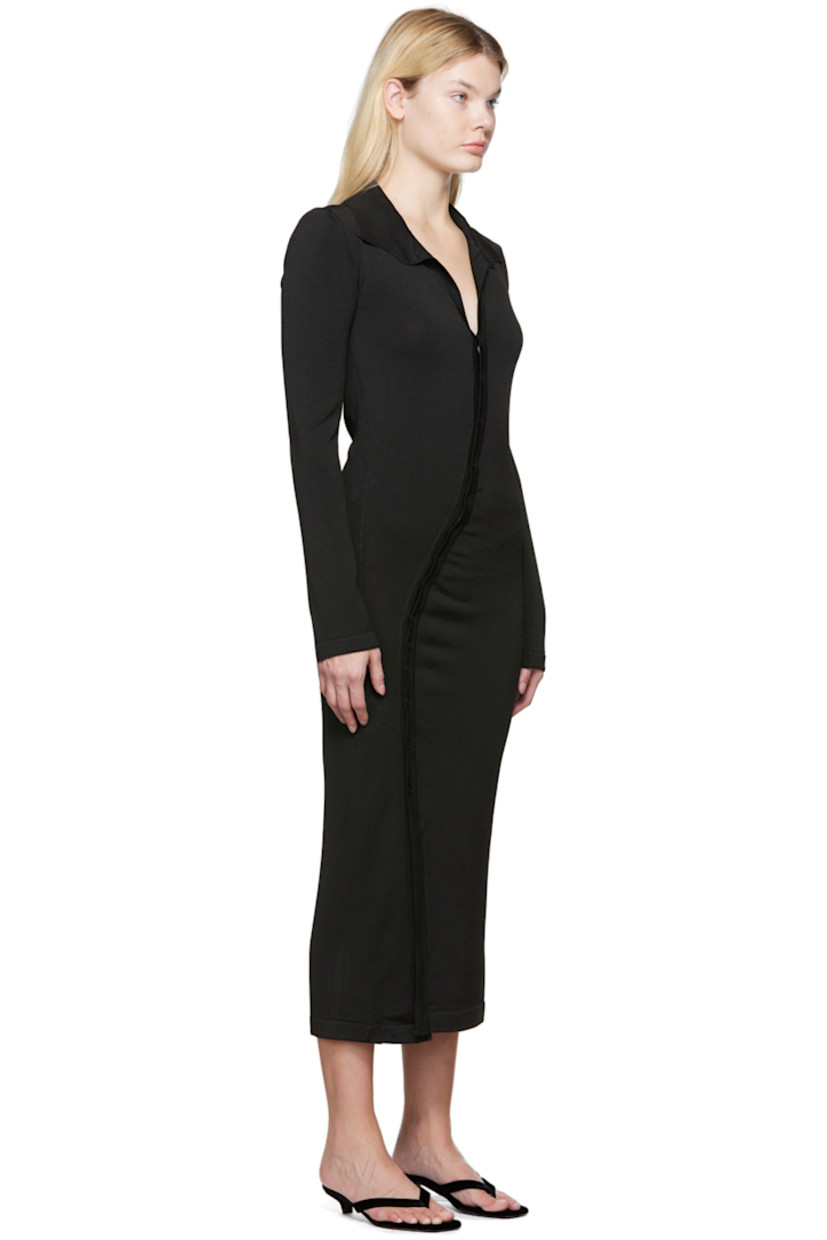 Viscose-blend jersey dress. 

· Spread collar
· V-neck
· Asymmetrical button closure
· Gathering at front 
· Vent at front hem 
· Unlined 

Supplier color: Black